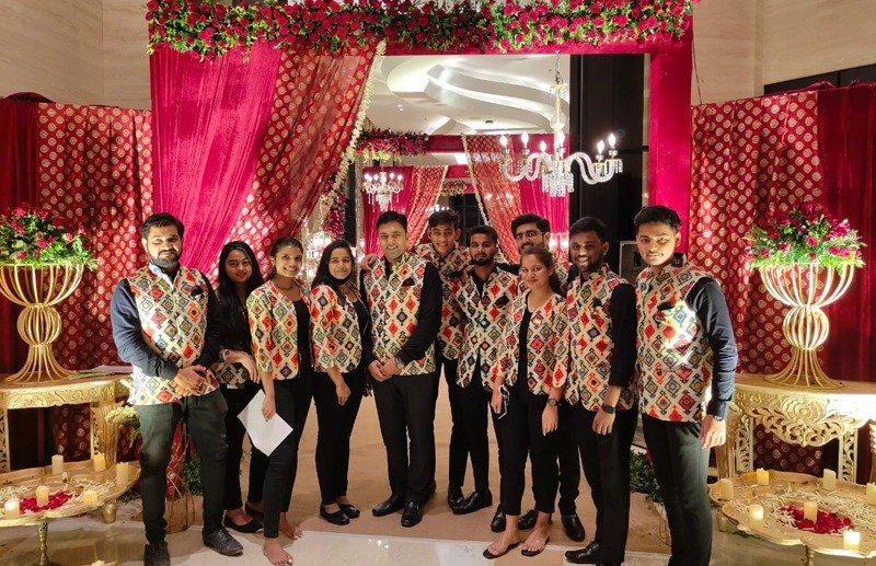 Radiance Hospitality team at a luxury wedding venue with pink floral decorations